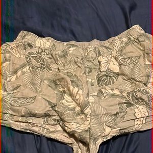 Shorts from pink a few shades of green with lighter green leaves